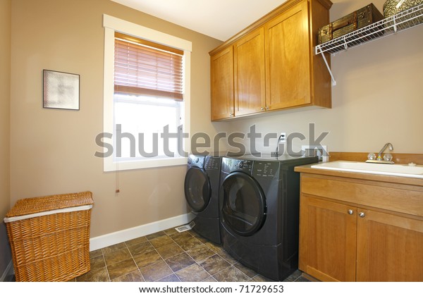 Laundry Room Black Appliances Nice Cabinets Stock Photo 71729653   Laundry Room Black Appliances Nice 600w 71729653 