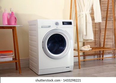 Laundry room interior with modern washing machine - Shutterstock ID 1433298221