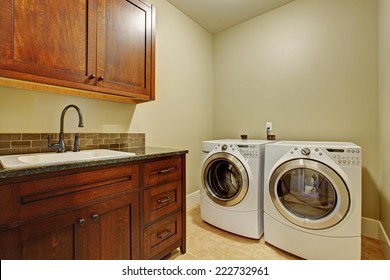 Laundry Room With Modern Appliances, Dark Brown Vanity Cabinet With Drawers.