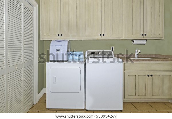 Laundry Room Washerdryerice Makersinkcabinetsand Pantry Area Stock