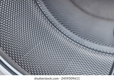 Laundry washing machine empty drum closeup