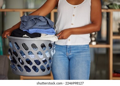 Laundry, woman and holding basket with clean clothes for home housekeeping. Closeup female, clothing fabric and laundry room of spring cleaning service, textile container and maintenance in apartment - Shutterstock ID 2246998127