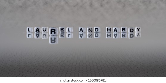 Laurel And Hardy Concept Represented By Wooden Letter Tiles