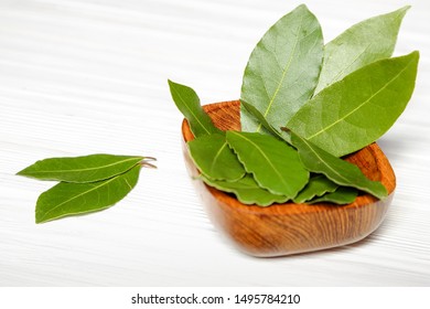 Laurel Or Sweet Bay In A Wooden Bowl On A White Table