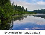 Laurentian forest reflection in the lake