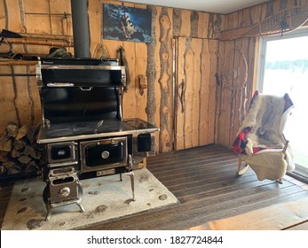 Laurentides, Quebec / Canada - February 25 2020: Typical Wood Stove In A Wooden Chalet In Laurentides, Quebec, Canada.