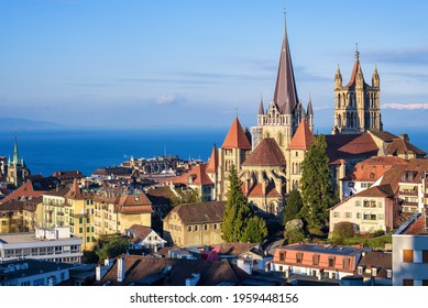 Lausanne city, view of the historical gothic Cathedral, Old town roofs and Lake Geneva, Switzerland