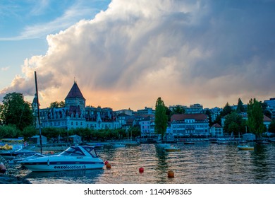 Lausanne / Switzerland - Aug 2015: Colorful sunset over Geneva lake. Dramatic sky over Lausanne town. Best place for holyday in Europe.