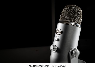 Lausanne Switzerland - Feb 3rd 2021

Blue Yeti USB Condenser Microphone With Built In Tabletop Ergonomic Grey Silver Stand Sitting On A White Table With A Dark Background And Dramatic Contrasty Light