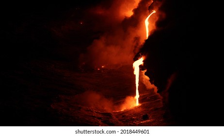 Lava Flowing Into The Ocean From Volcano Lava Eruption On Big Island Hawaii. Lava Stream Flowing In Pacific Ocean From Kilauea Volcano By Hawaii Volcanoes National Park, USA.