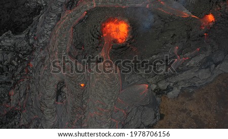 Lava Flows on active volcano aerial view, Mount Fagradalsfjall, Iceland
of Hot lava and magma coming out of the crater, April 2021 
