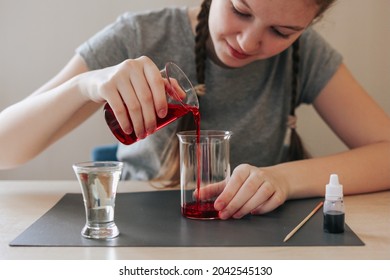 Lava lamp, science experiment with water, food coloring, oil and aspirin doing by school girl. Step by step process of doing homework. Education, back to school, distant concept. - Powered by Shutterstock