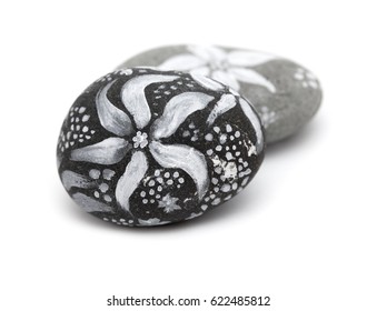 Lava Pebble Painted With White Paint Isolated