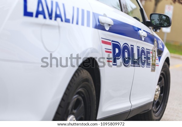 Laval, Quebec, Canada:\
May 19, 2018. A real police car of the municipal police department\
in Laval town, during operative intervention. Inscriptions on the\
car – Police.