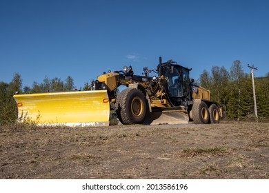 Lavangen, Norway 06.06.2021: Caterpillar Motorgrader 150 Cat Scraper Grade 150