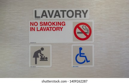 Lavatory Sign Placard On Aircraft.