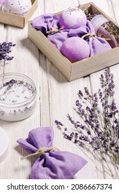 Lavender Bath Bombs, Sea Salt, Sachets, Aromatherapy Sleep Spray, Fragrant And Healthy Spa Products With Lavender Essential Oil. Herbal Medicine Concept, Cosmetic For Body Treatment, Wooden Table