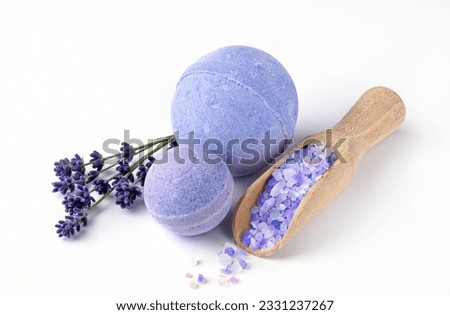 Lavender bath bombs and sea salt with lavender flowers on white background. Herbal healthy beauty spa products. Aromatherapy and herbal medicine for body treatment.