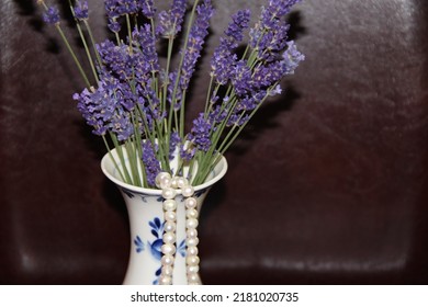 Lavender Bouquet In A White Porcelain Vase On A Dark Background