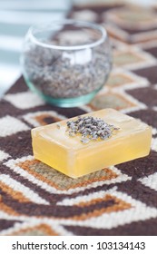 lavender in bowl and soap on ethnic mat - Shutterstock ID 103134143