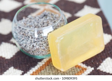 lavender in bowl and soap on ethnic mat - Shutterstock ID 109809395