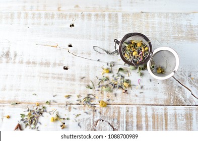 Lavender And Chamomile Loose Tea Herbs On White Wash Wooden Background