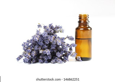 Lavender And Essential Oil On White Background