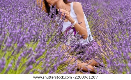 Similar – Woman posing in field of white flowers