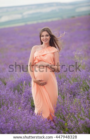 Lavender field and a happy pregnant woman