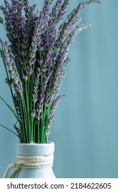 Lavender Flower In Vase On Aqua Color Background. Scandinavian Home Style.