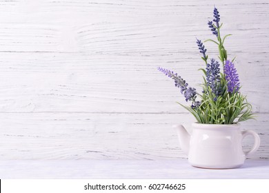 Lavender Flowers In Watering Can, Wooden Background, Copy Space