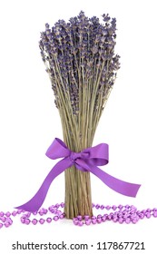 Lavender Herb Flower Bundle Tied With A Purple Satin Ribbon With Loose Bead Strand Over White Background.