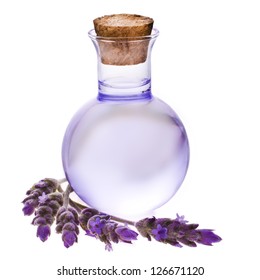 Lavender herb flower water in a glass bottle with flowers , isolated on white background.