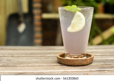 Lavender Lemon Juice With Ice On Wooden Table