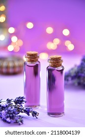 Lavender Oil And Lavender Flowers On Bokeh Background