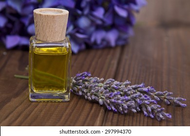 Lavender And Oil On Wooden Background