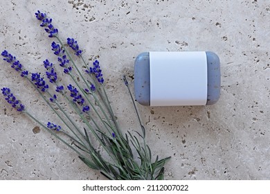 lavender soap with blank banderole and fresh lavender on stone plate