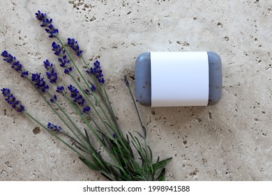 Lavender soap with unlabeled white banderole with fresh lavender flowers