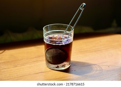 Lavender Tea Drink with Sieve in Transparent Glass - Shutterstock ID 2178716615