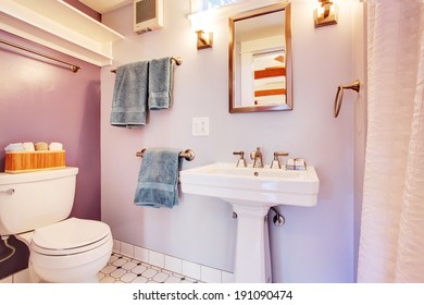 Lavender Walls Bathroom With White Appliances. Detached Guest House Vacation Rental Cottage.