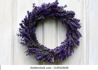 Lavender Wreath On An Old White Wooden Door.