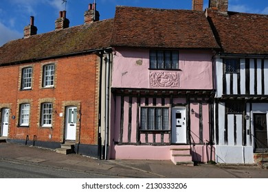 Lavenham, Suffolk, United Kingdom, February 21, 2022. exterior of old crooked and quaint medieval, Tudor or Elizabethan half timbered house. In historic wool town.  Outdoors on a bright winters day