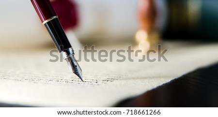 Law background theme. Fountain pen and handmade paper. law lawyer pen will notary paper legacy background concept