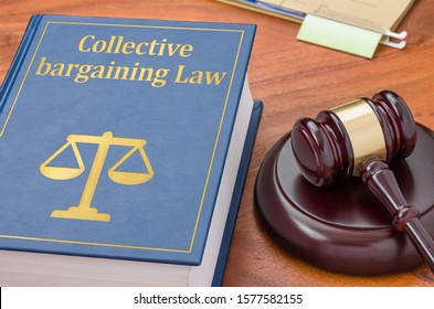 A law book with a gavel  - Collective bargaining Law - Shutterstock ID 1577582155