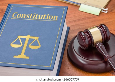 A law book with a gavel - Constitution - Shutterstock ID 266367737