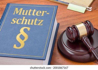 Law Book With A Gavel - Maternity Protection In German - Mutterschutz