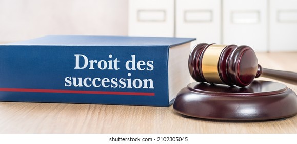 Law book with a gavel - Law of succession in french - Droit des succession - Shutterstock ID 2102305045