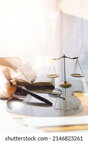 Law Books And Scales Of Justice On Desk In Library Of Law Firm. Jurisprudence Legal Education Concept.