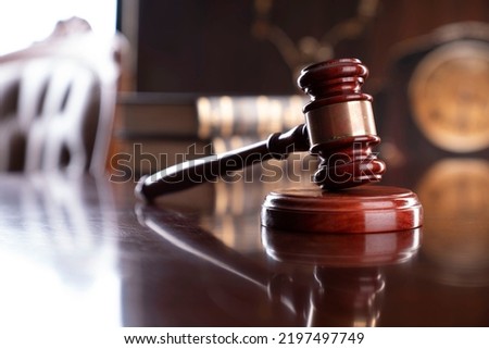 Law code concept. Mallet of the judge on wooden table.