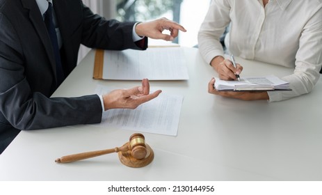 Law Concept The Lawyer Partner Who Wears Simple White Shirt Attempting To Catch Up And Write Down From What Her Boss Says.